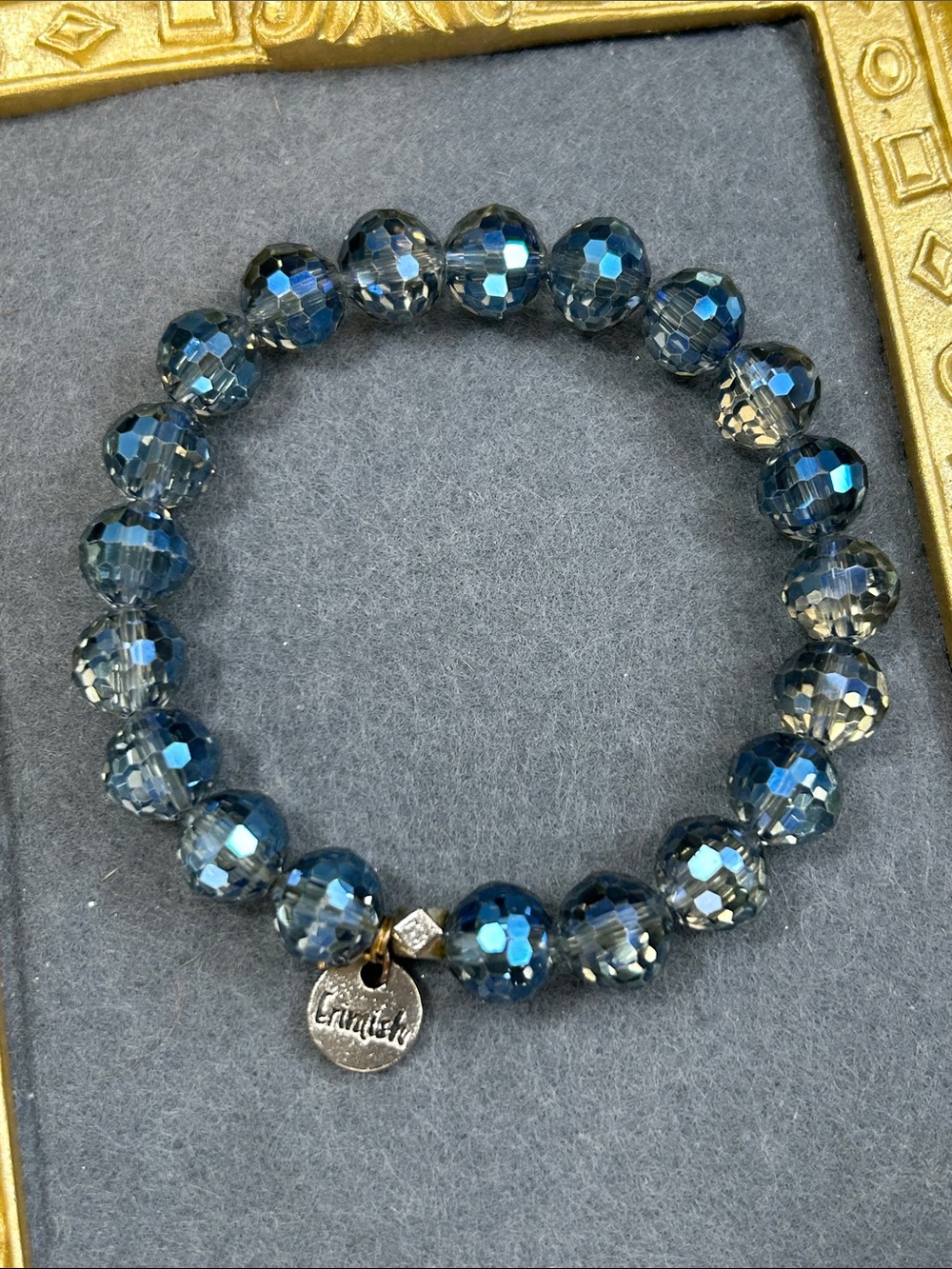 Erimish Faceted Blue Bead Stretch Bracelet with Logo Charm